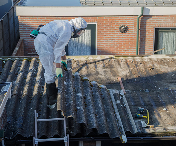 PPE wearing worker on small roof